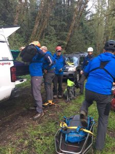 Image may contain: one or more people, people standing, tree, outdoor and nature