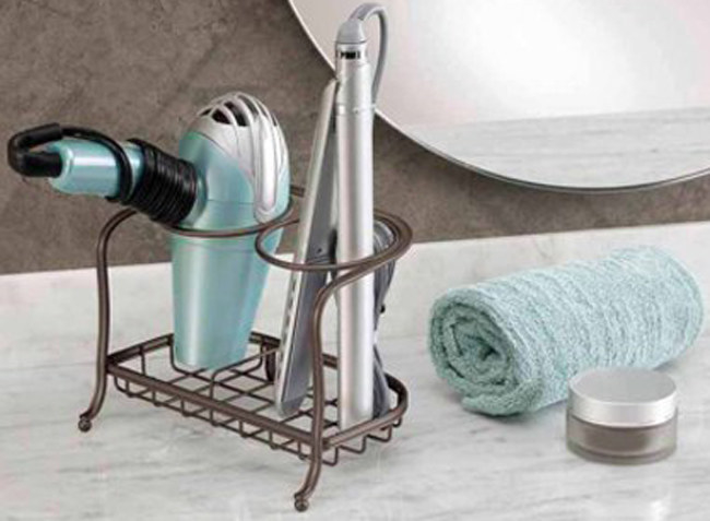 Promising review: &quot;This hair-dryer and flat-iron holder works great! It helped to organize my vanity and make it much neater. It is heavy and balanced, which keeps it from tipping over. I also like the oil-rubbed bronze finish. This is a nice product!” —LisaHG Price: .87
