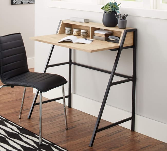 Promising review: "This is great for a small computer and as a desk or vanity. I have a Mac and I have my monitor positioned on top of the hutch. I was really surprised that the wood on this doesn't look 'cheap.' I assembled it myself in an hour or so. It was not difficult to put together. I thought the instructions were pretty straightforward. I think it looks really chic and it's perfect for my office. I plan on also buying it in white. I love this collection!" —Rose
Price: (available in black and navy)