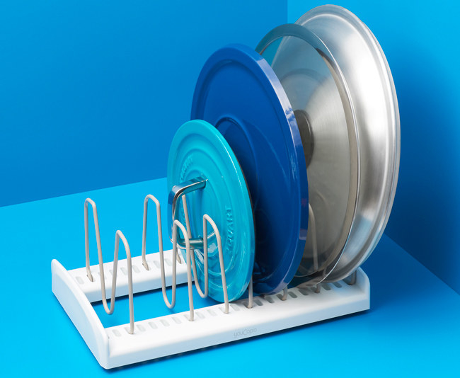 Promising review: “This is exactly what I need for my pot lids. They always seem too big for any other type of organizer. But being that this is adjustable, they fit perfectly. This organizer is also non-slip, so you don&#x27;t have to chase it all over the cabinet to retrieve your lid.” —DeppLover Price: .87