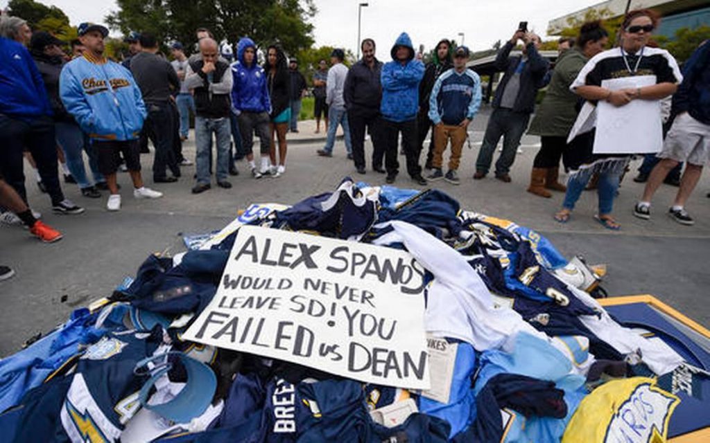 Image may contain: one or more people, shoes, crowd and outdoor