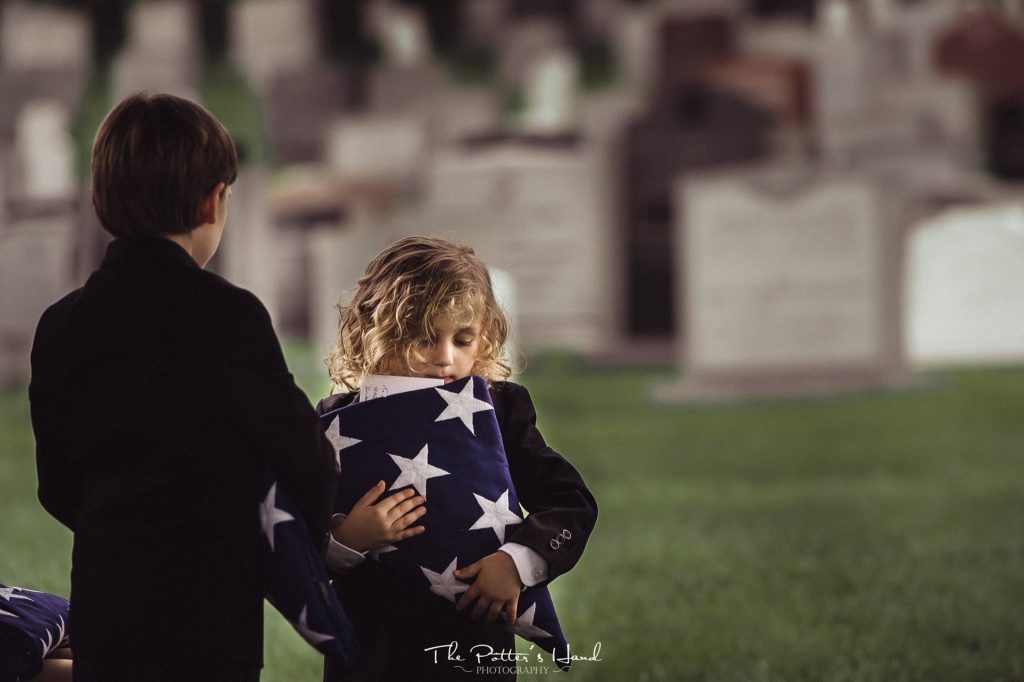 Image may contain: 1 person, child, grass and outdoor