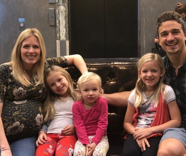 Image may contain: 5 people, people smiling, people sitting