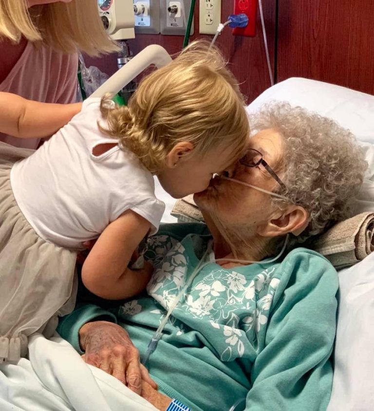 Image may contain: one or more people, people sitting and glasses