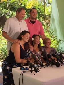 Image may contain: 5 people, people smiling, people sitting and outdoor