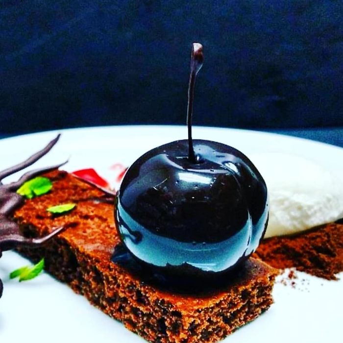Chocolate Cherry Ganache,mirror Glazed And Served With Chocolate Sponge, Cream And A Cherry Gel Chocolate Cherry Ganache,mirror Glazed And Served With Chocolate Sponge, Cream And A Cherry Gel