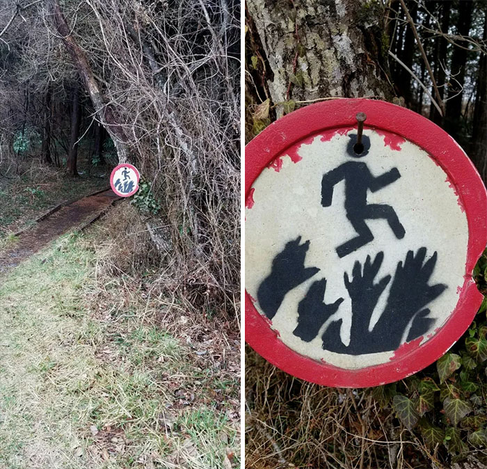 Sign I Found In The Woods That Depicts A Man Jumping Over Some Scary Looking Hands Sign I Found In The Woods That Depicts A Man Jumping Over Some Scary Looking Hands