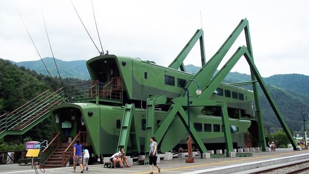 Grasshopper-Shaped Locomotives Stacked On Top Of Each To Create A Diner In South Korean Grasshopper-Shaped Locomotives Stacked On Top Of Each To Create A Diner In South Korean