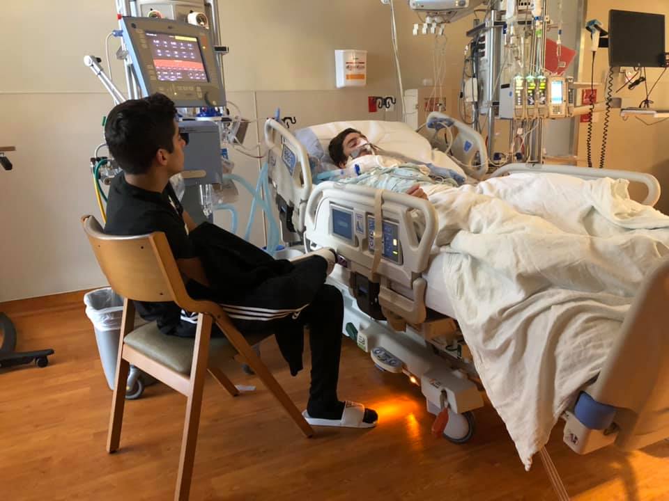 Image may contain: one or more people, people sitting and indoor