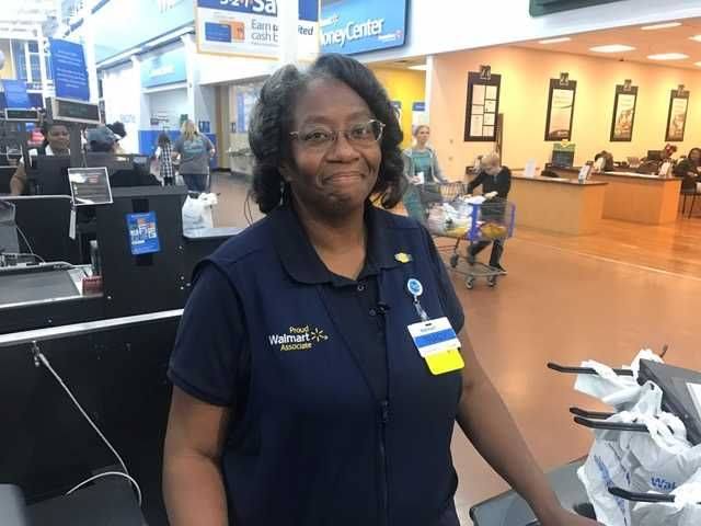 Image may contain: 1 person, smiling, standing