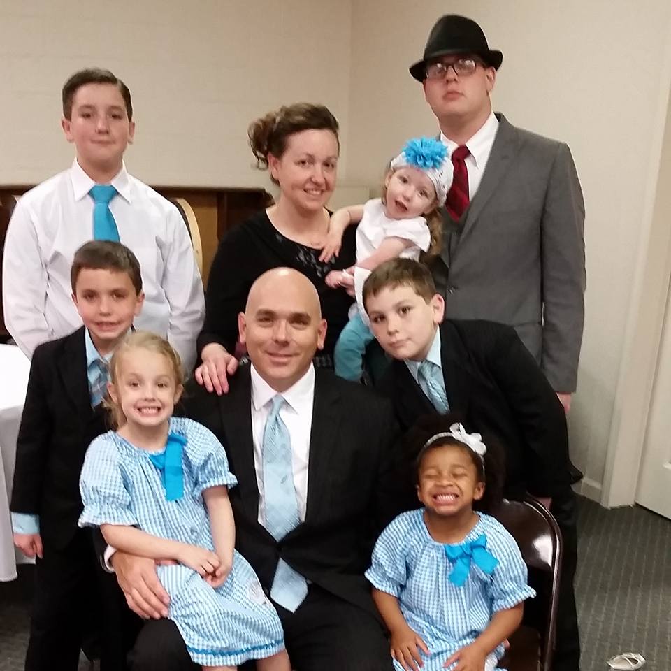 Image may contain: 9 people, people smiling