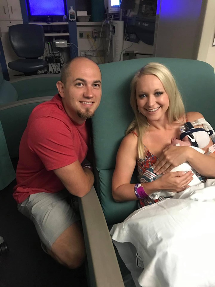 Image may contain: 2 people, people smiling, people sitting