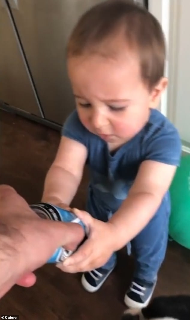 Stopped in his tracks: Finally Rudy Salo catches up with the toddler but he refuses to let go