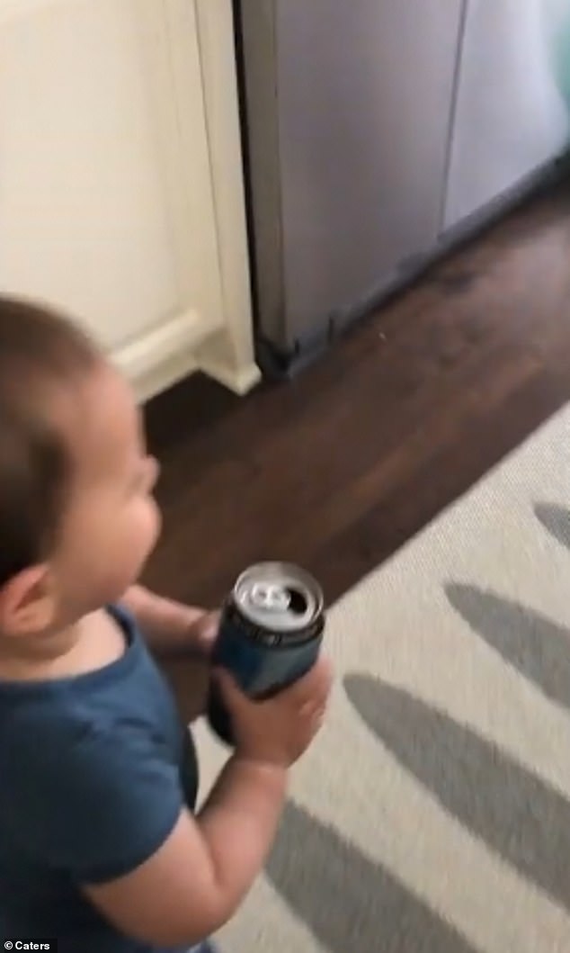 On the run: Fourteen-month-old Aleks makes a dash for it with his dad