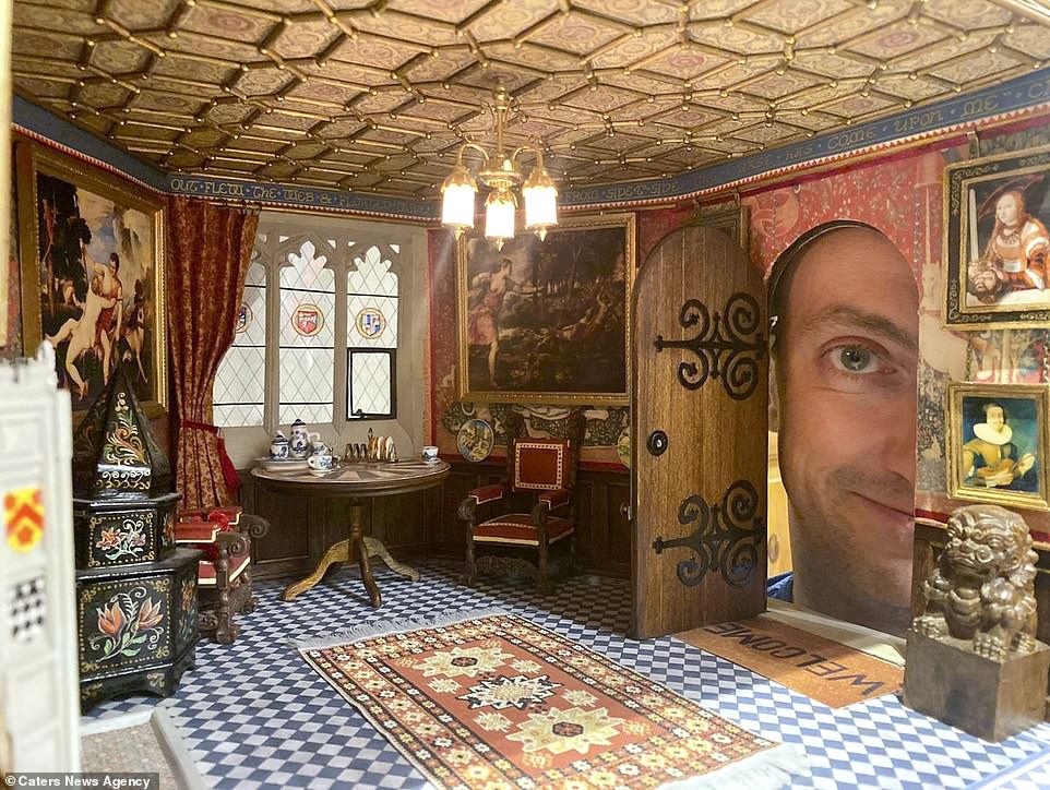 The National Trust enthusiast has spent over 30 years building his own miniature stately home with every feature having been inspired by actual historic properties. Pictured: Jon peeks through the main door into the entrance hall