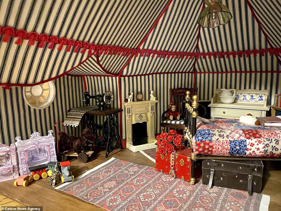 The 42-year-old has so far built eight rooms as part of the project which he has named Hordle Castle including a lavish attic room (pictured) that was inspired by the nursery at Kingston Lacy in Dorset. It includes its own Dutch cabinet doll