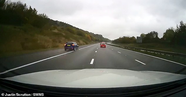 The driver speeds past the Mercedes-Benz lorry and returns to the slow lane before speeding into the distance in a spray of rainwater