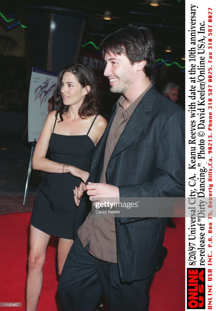 8/20/97 Universal City, CA. Keanu Reeves with date at the10th anniversary re-release of "Dirty Danci : News Photo