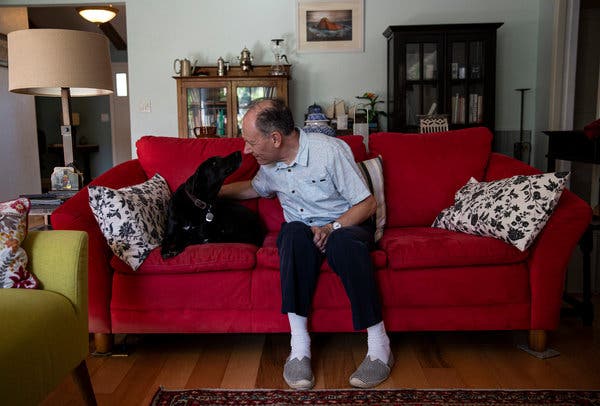 Clive Wynne, a psychologist at Arizona State University, at home with his dog, Xephos, who loves him very much.