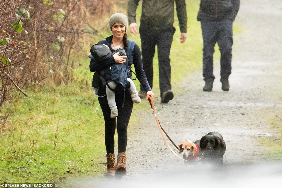 She wrapped up in layers under a green beanie hat, wearing black leggings and her favourite Kamik ankle-high brown hiking boots
