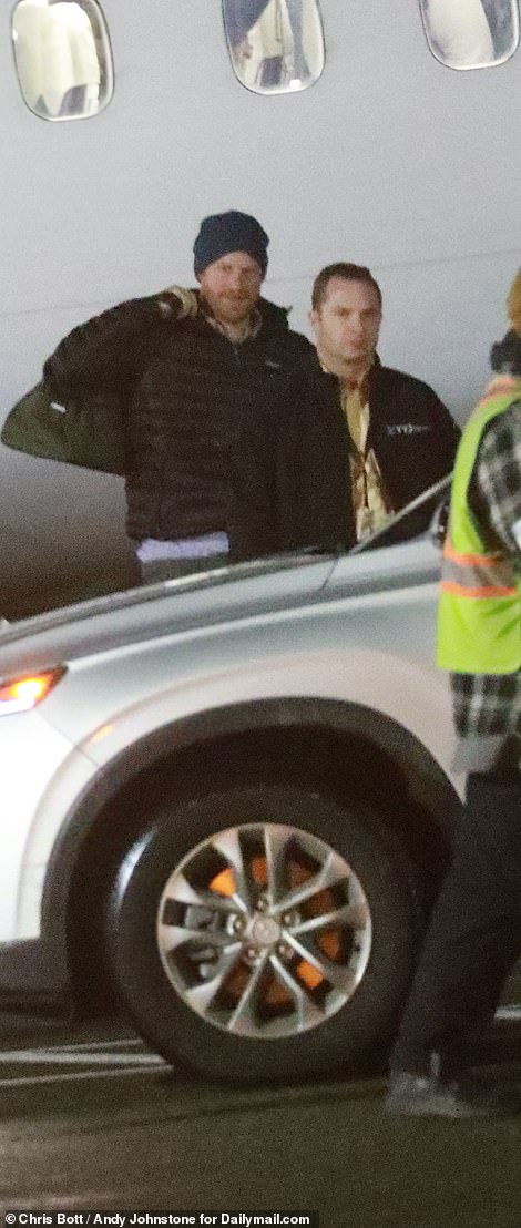 Harry is pictured getting a transfer direct from the tarmac