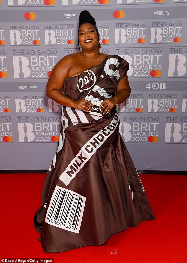 Showstopper: Lizzo was a sight to behold as she arrived on the red carpet in a chocolate themed gown at the BRIT Awards at The 02 Arena in London on Tuesday
