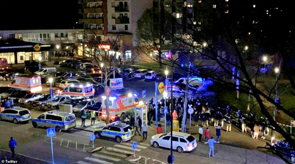 Emergency service swarmed the area after the shooting. A silver Mercedes covered with rescue blankets was seen in front of a bar in Hanau