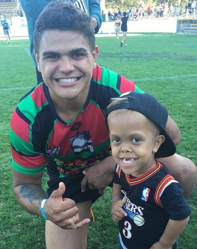 Quaden is pictured with NRL star Latrell Mitchell. The nine-year-old will lead the Indigenous All Stars NRL team onto the pitch on Saturday