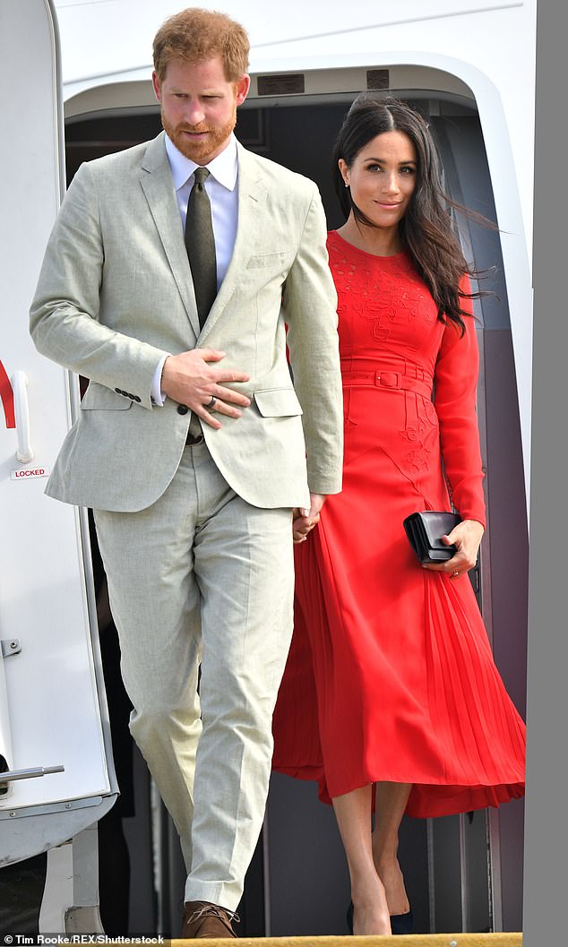 The source explained the Queen fears the ongoing discussions are damaging to the monarchy as an institution. Pictured, Harry and Meghan on their royal tour of Tonga in October 2018