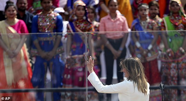 Melania Trump waves to the crowd when she appeared at President Trump