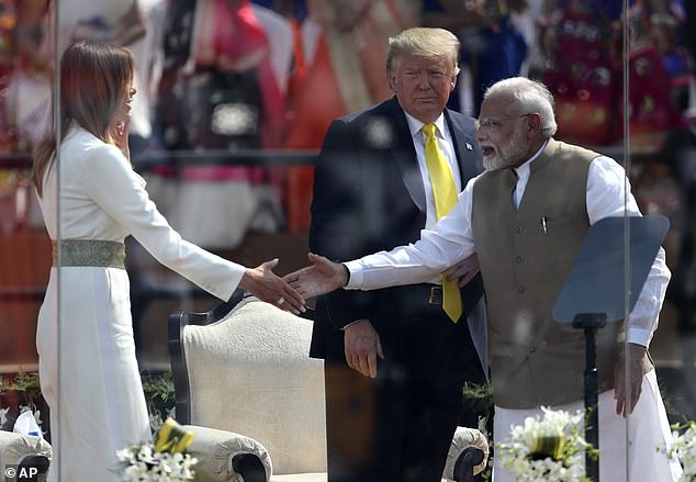 Melania shakes hands with Prime Minister Modi during an event at Sardar Patel Stadium where he praised her work with children as part of her 