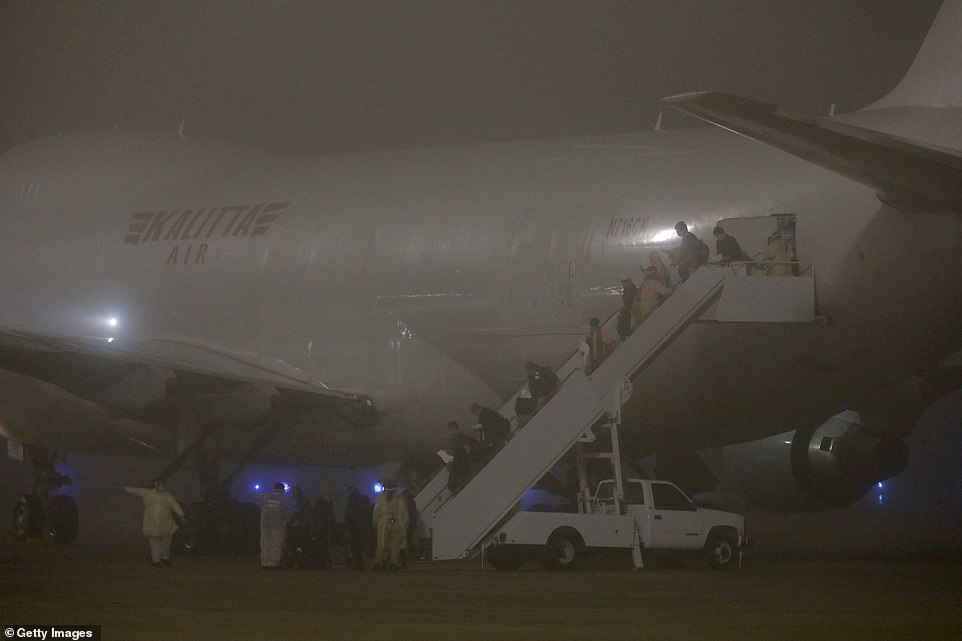 American evacuees from the Diamond Princess cruise ship arrive at Joint Base San Antonio-Lackland on February 17