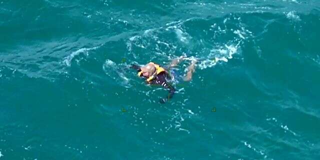 The kayaker Alex can be seen treading water on Sunday.