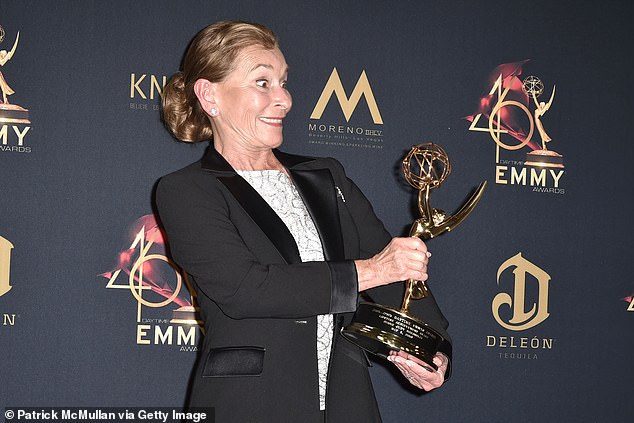 Feted: Judge Judy posed with a Daytime Emmys Lifetime Achievement Award she received last May in LA