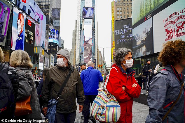 US hospitals are preparing for 96 million coronavirus infections and nearly half a million deaths from the outbreak, leaked documents have revealed. People are pictured wearing face masks in Times Square, New York on March 3