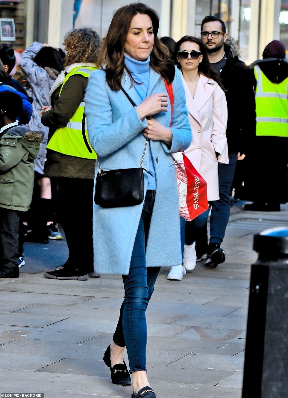 Kate walked with the Waterstones bag slung over her shoulder
