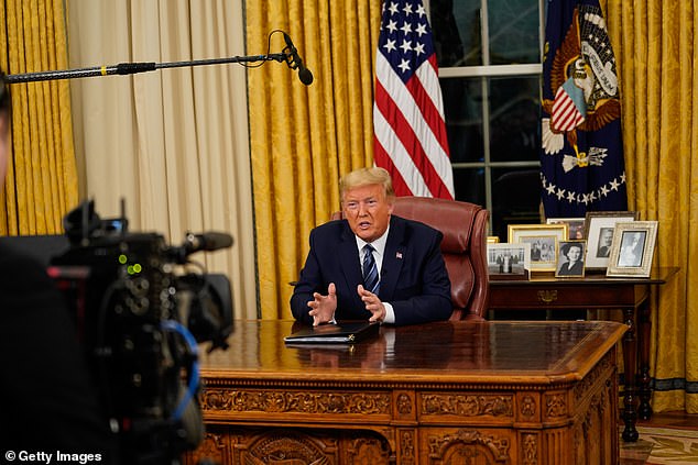 Moment of history: How Donald Trump addressed the nation from behind the Resolute desk, with a single camera and stills photographer allowed in the room