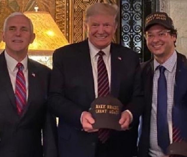 From left: Vice President Mike Pence, President Donald Trump, and Fabio Wajngarten, the communications secretary for Brazilian President Jair Bolsonaro. The three men posed for a photo on Saturday at Trump