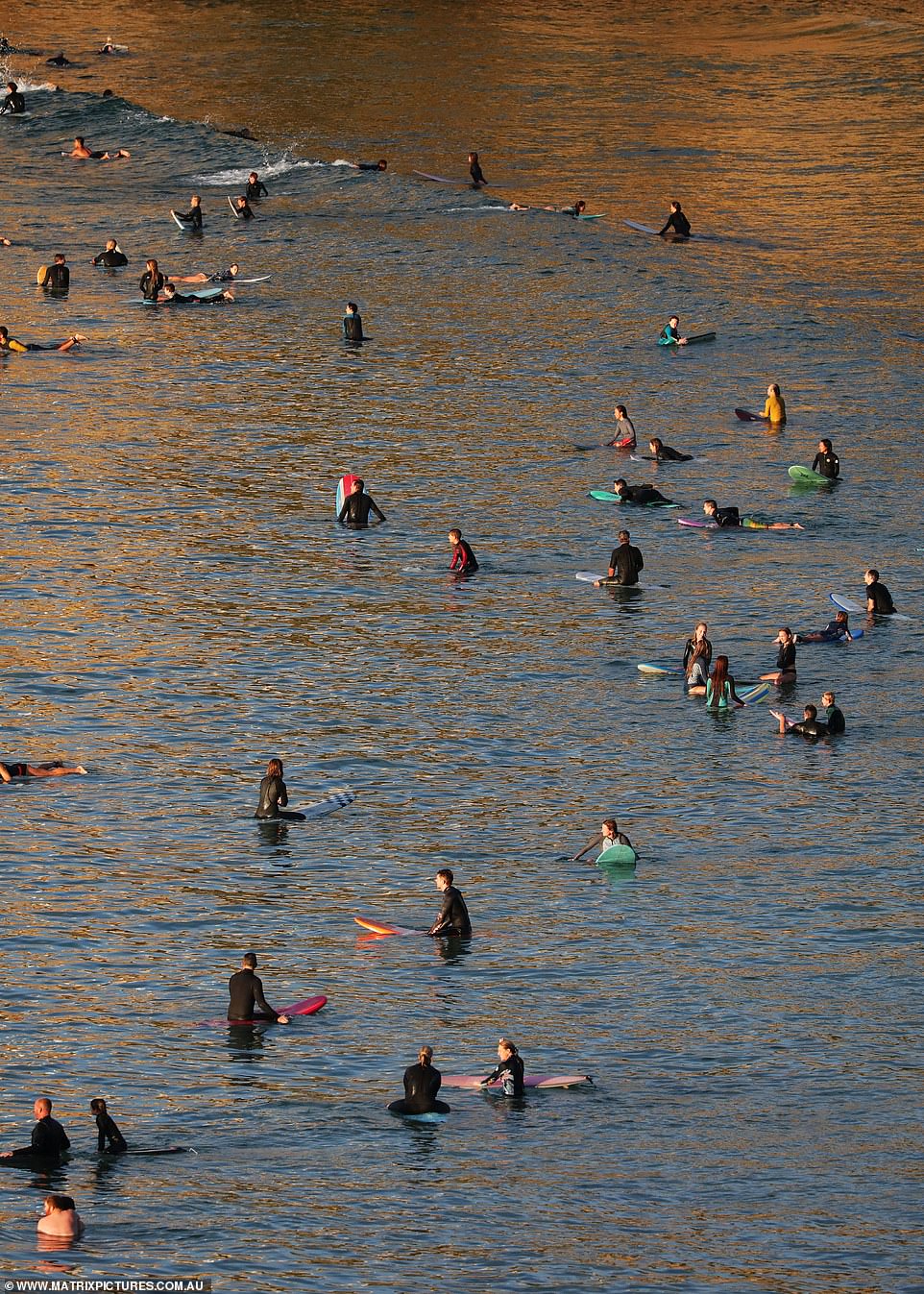 Surfers flouted the rules by sitting on their boards for a morning catch-up on Friday