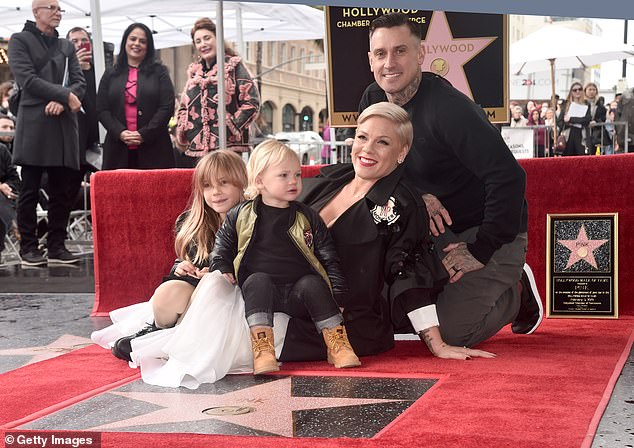 Family first: Pink is married to 44-year-old motorcycle and off-road truck racer Carey Hart as they also have an eight-year-old daughter named Willow together, as the entire family are seen here at her Hollywood Walk Of Fame Ceremony in February 2019