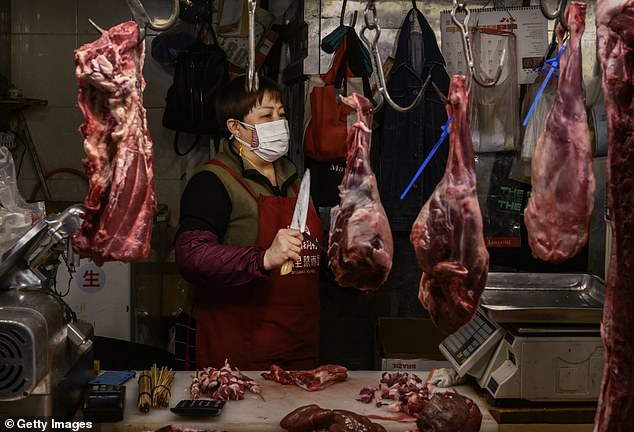 Scott Morrison called for Chinese wild animal markets (pictured) to be banned as there has been widespread speculation the coronavirus spread to humans at these 