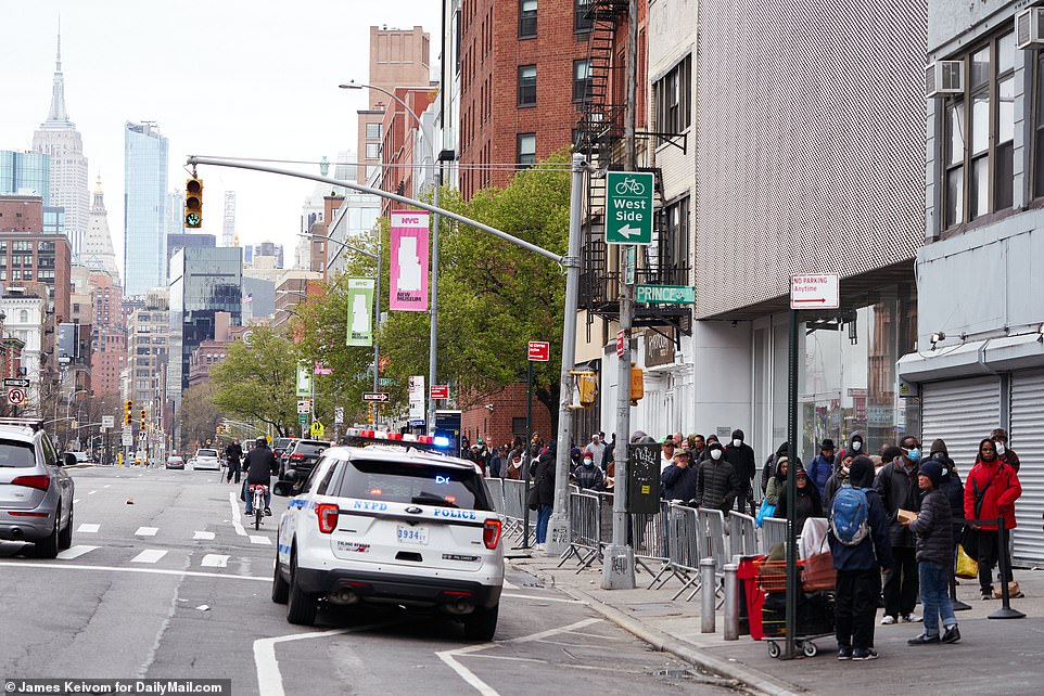 Lines were seen going beyond down the block with many people seen wearing protective masks and gloves
