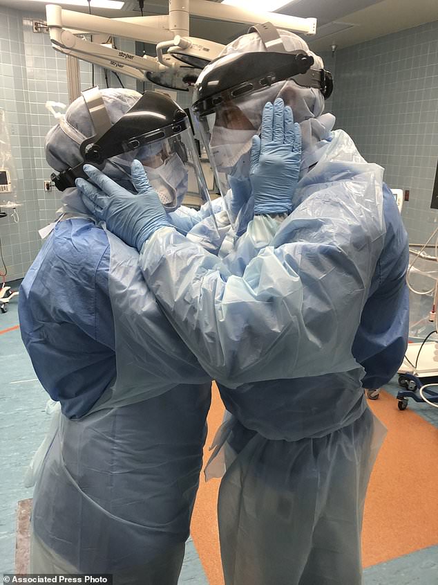 Inspiring: A co-worker photographed Ben Cayer, 46, and Mindy Brock, 38, looking into each other