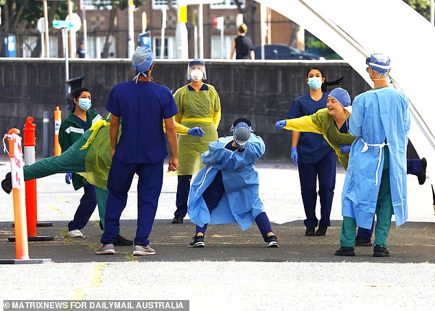 The Bondi drive through testing facility grinds to a halt and the clinicians are so bored they have choreographed a dance which involves swabbing, swishing and distancing