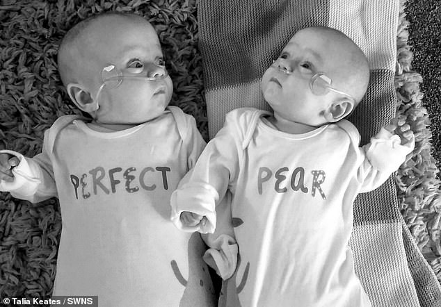 Ashley and Joe pictured in their matching baby grows. The family thought they were