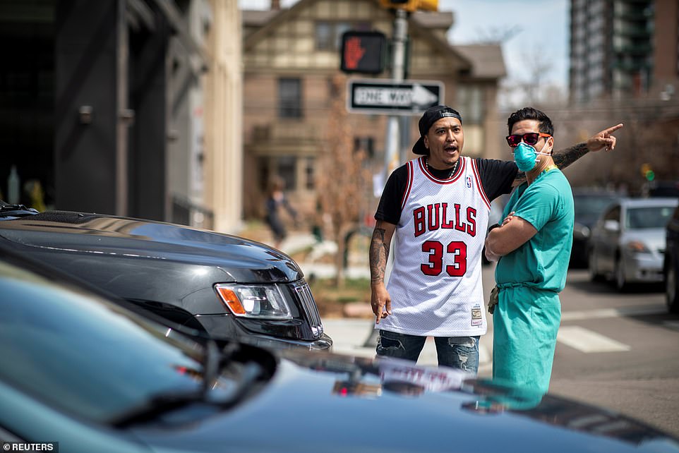 The driver was seen angrily approaching the nurse, ordering him to move out of the way, but the healthcare worker remained unmoved, opting simply to look in the other direction