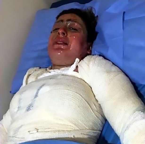 Woman pictured writhing in pain dies after 