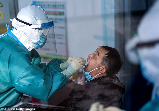 Beijing claims that the total number of confirmed coronavirus deaths in China is 4,632 people . But there is widespread disbelief of those figures across the globe by Western leaders who accuse Beijing of letting coronavirus spread across the globe while its leaders saved face. Medical personnel take swab samples of a man from a man in in Suifenhe, in China