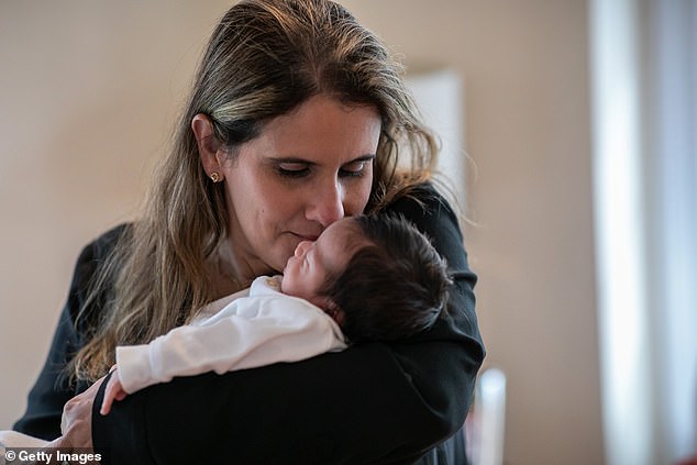 Elementary school student Luciana Lira, 32, has become a temporary guardian for a newborn boy named Neysel, whose parents were both struck down with coronavirus