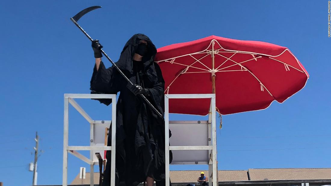 A lawyer dressed as the Grim Reaper is haunting Florida beaches to ...
